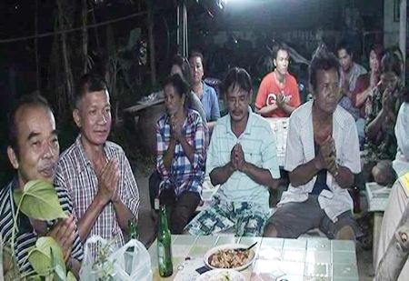 Family and friends gather around to say their final goodbyes to Jao Saen, their beloved water buffalo.